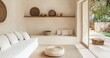 © David Giraud - Salon bohème beige avec canapé blanc, tapis et paniers tressés sur une étagère. Aménagement intérieur minimaliste d'une pièce d'habitation moderne et épuré avec porte vitrée donnant sur jardin.