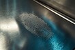 © woters - Fingerprint impression found on a metallic surface highlighting unique ridge patterns and details under natural light
