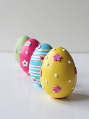 Poster - A Vibrant Display Of Colorfully Decorated Easter Eggs In A Single Row Adds Festive Charm To Any Table Setting Easily.