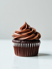 Poster - A Delicious Single Chocolate Cupcake Sits Alone On A Clean White Surface, Awaiting Its Fate In The Kitchen.