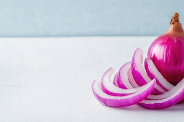 Poster - vibrant photo of sliced red onion displayed on plain white surface with intricate textures and generous copy space