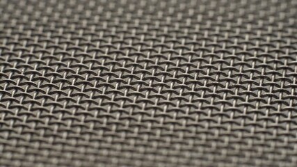 Metal wire mesh rotating in circle. Abstract background texture macro