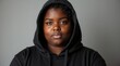 © Caspernik - Confident Black Young Woman in Black Hoodie Studio Portrait