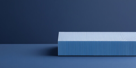 Poster - Textured block on deep blue backdrop.  Minimalist, modern design element. Geometric form with linear detail, cool monochrome palette. Product showcase.