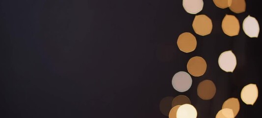 Poster - Elegant bokeh light pattern transition across dark background