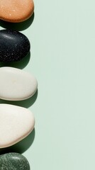 Poster - Decorative stones arrangement on soft green background nature still life minimalist aesthetic