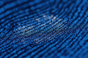 Poster - Captivating macro shot of a blue textured surface with shimmering golden highlights creating a unique pattern