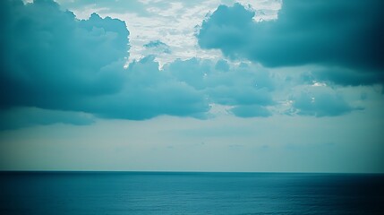 a deep blue twilight sky filled with gentle cloud formations, transitioning into the peaceful calm o