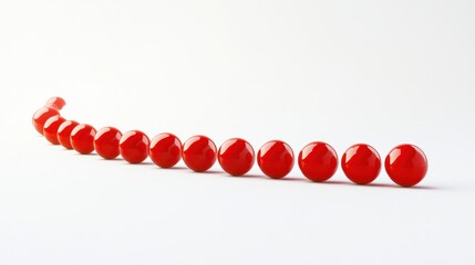 Poster - Glossy Red Balls Arranged in a Curved Line on White Background