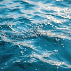 Poster - Tranquil turquoise water surface with gentle waves and sunlight reflections creating a serene and calm aquatic scene ideal for backgrounds