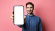 © photostockatinat - a man showing a blank mobile phone screen, with a pink backdrop