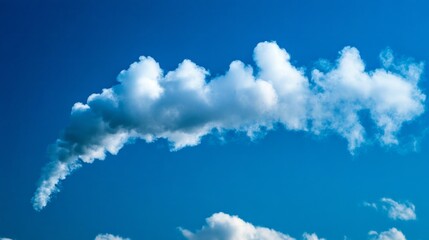 Aufkleber - A playful cloud stretches elegantly across a vivid blue sky, creating delightful patterns as sunlight illuminates its soft edges. The peaceful afternoon invites tranquility