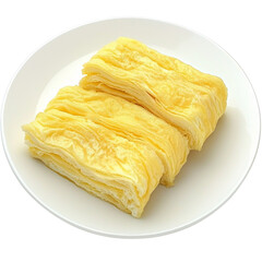 Poster - Fresh yellow tofu sheets stacked on white plate, showcasing their smooth texture and soft appearance. Ideal for various culinary dishes and vegetarian recipes