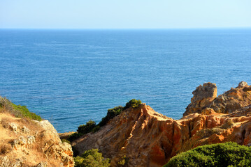 Wall Mural - walking path with breathtaking views through the coast from porches to benagil caves lagoa algarve portugal