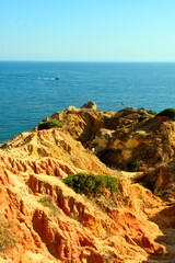 Wall Mural - walking path with breathtaking views through the coast from porches to benagil caves lagoa algarve portugal