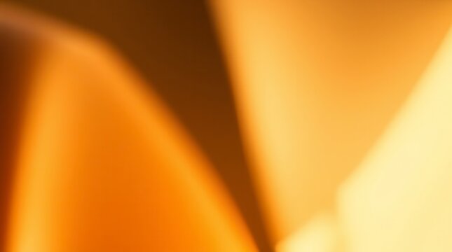 Abstract background with blurred gradient of warm orange and brown tones, creating dynamic shadows.