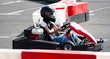 © Ievgen Skrypko - Kid Driving Fast Go Kart By Racing Track, Extreme Entertainment Park