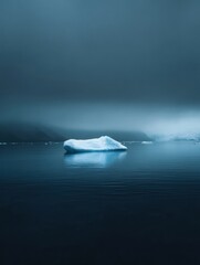 Fototapete - Melting iceberg drifts in calm dark blue waters with an empty sky ideal for text placement. Generative AI