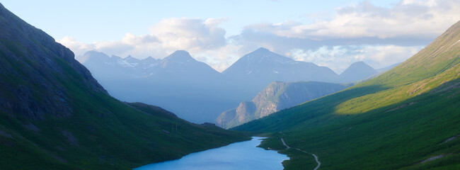 Wall Mural - nature in norway. panoramic view of wild norway. lake among the rocks and mountains. bright sunshine