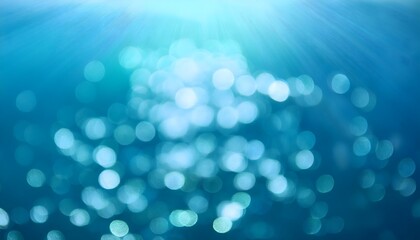 Wall Mural - abstract underwater bokeh lights blurred background with blue, aqua and turquoise sparkling glowing 