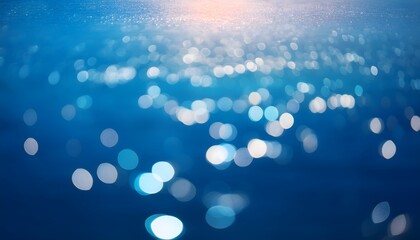 Wall Mural - abstract underwater bokeh lights blurred background with blue, aqua and turquoise sparkling glowing 