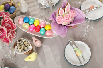 Canvas Print - Festive table setting with flowers, Easter cakes and painted eggs