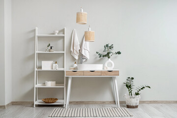 Wall Mural - Interior of bathroom with shelving unit and table near white wall