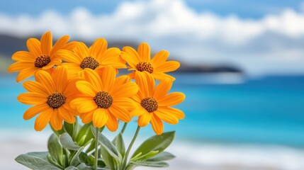 Canvas Print - A vibrant display of yellow flowers arranged in a vase, set against the serene backdrop of a sandy beach.