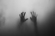 © puritut - A black and white photograph of two hands behind a foggy glass creates an eerie atmosphere.