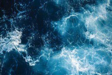 Poster - Aerial View of the Deep Blue Sea with White Foaming Waves and Turquoise Patches Creating a Captivating Marine Landscape Showing Natural Beauty