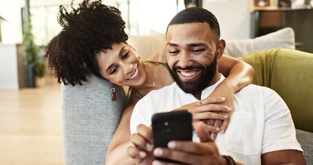 Poster - Couple, phone and couch with social media, hug and smile together in home with app. Online shopping, streaming and happy people with technology and mobile video with web meme on the internet
