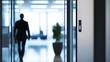 © bussi - Executive departures with an office door ajar. Featuring leadership change and career transition