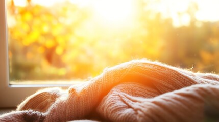 Aufkleber - Knitted Blanket Resting on a Cozy Windowsill with Autumn Light : Generative AI