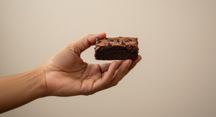 delicious chocolate brownie in hand