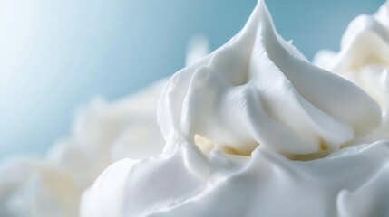 Poster - Close up view of fluffy whipped cream texture against a soft blue background for culinary uses : Generative AI