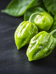 Poster - Fresh and organic green habanero peppers on dark background with vibrant color : Generative AI