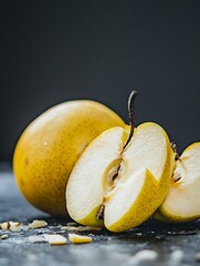 Poster - Ripe yellow pear sliced open revealing juicy flesh and seeds against a dark background : Generative AI