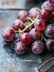 Poster - Freshly harvested plump purple grapes glistening with water droplets on rustic dark table : Generative AI