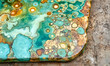 © Ida - Abstract turquoise and gold stone texture showcasing organic patterns