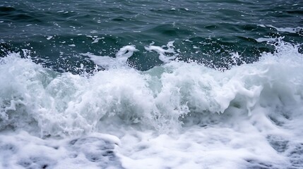 Poster - Crashing ocean waves creating foam and spray on a rocky shoreline under a cloudy sky : Generative AI