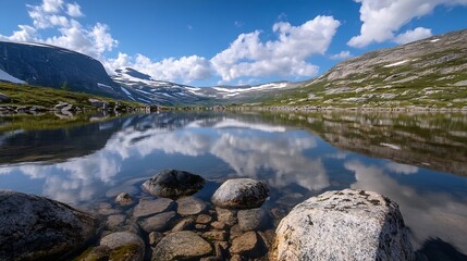 Aufkleber - Stunning panoramic view of serene lake surrounded by majestic mountains and fluffy clouds reflecting in clear water : Generative AI