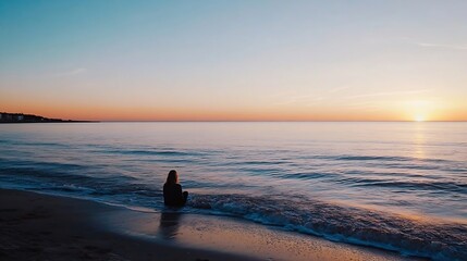 Aufkleber - Tranquil Sunset Scene with Person Seated by Calm Ocean Waves at Dusk : Generative AI