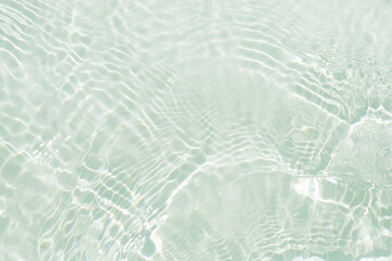 Wall Mural - Blue water with ripples on the surface. Defocus blurred transparent blue colored clear calm water surface texture with splashes and bubbles. Water waves with shining pattern texture background.