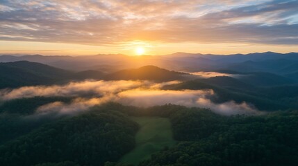 Poster - Aerial view of sunrise over lush green mountains with mist creating a serene landscape : Generative AI