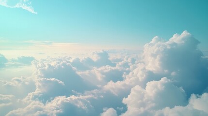 Aufkleber - Fluffy white clouds float peacefully in a bright blue sky, creating a sense of calm and wonder. This tranquil view invites deep breaths and reflective moments high above the world
