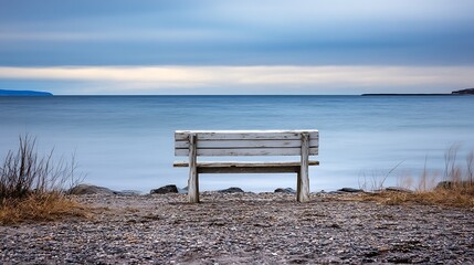 Aufkleber - Secluded Beach Bench Overlooking Calm Waters and Soft Clouds at Dusk : Generative AI