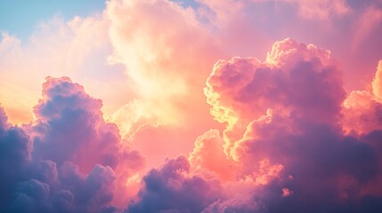 Poster - An enchanting view of fluffy clouds bathed in hues of pink and orange as the sun sets, creating a peaceful atmosphere above a calming landscape. The sky glows with warmth