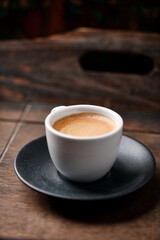 Wall Mural - Cup of coffee on wooden background. Soft focus. Copy space.	