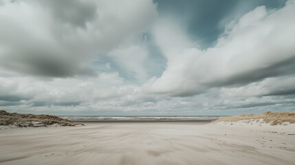 Poster - wide sandy beach with dramatic clouds and distant ocean waves