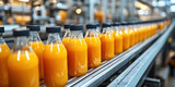 Automated juice bottling line in modern factory with orange juice